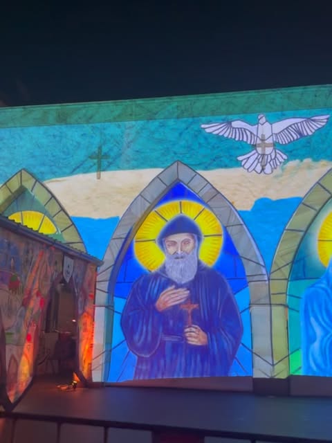 Tia's drawing of St Charbel projected onto the monastery wall during the light show